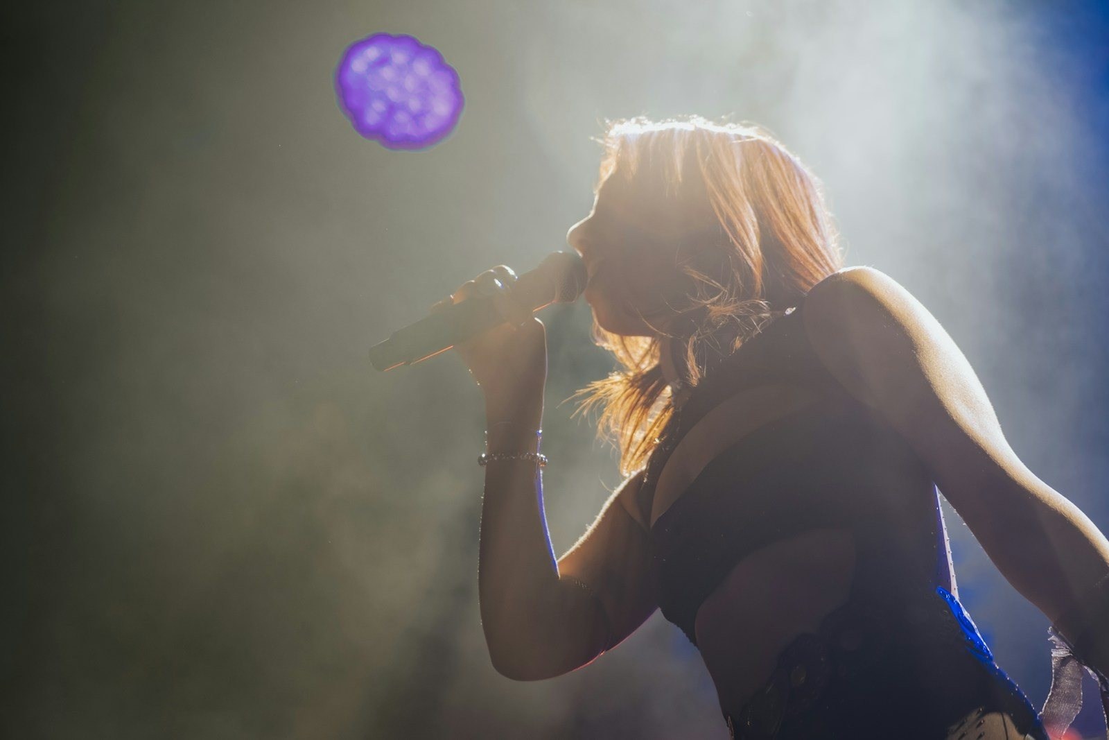 Stock photo: a singer in stage light