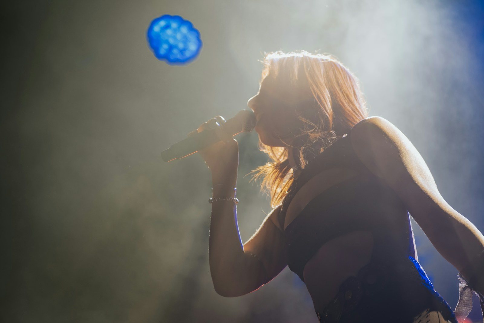 Stock photo: a singer in stage light